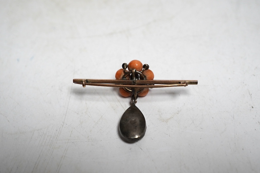 A Victorian coral, paste and seed pearl bar brooch, unmarked. Condition - some wear to the stones, otherwise fair